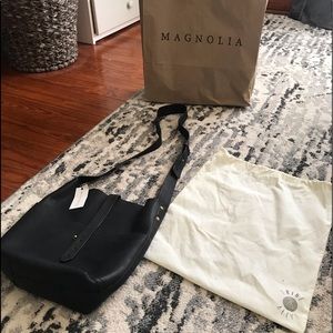 Brand new black leather messenger bag